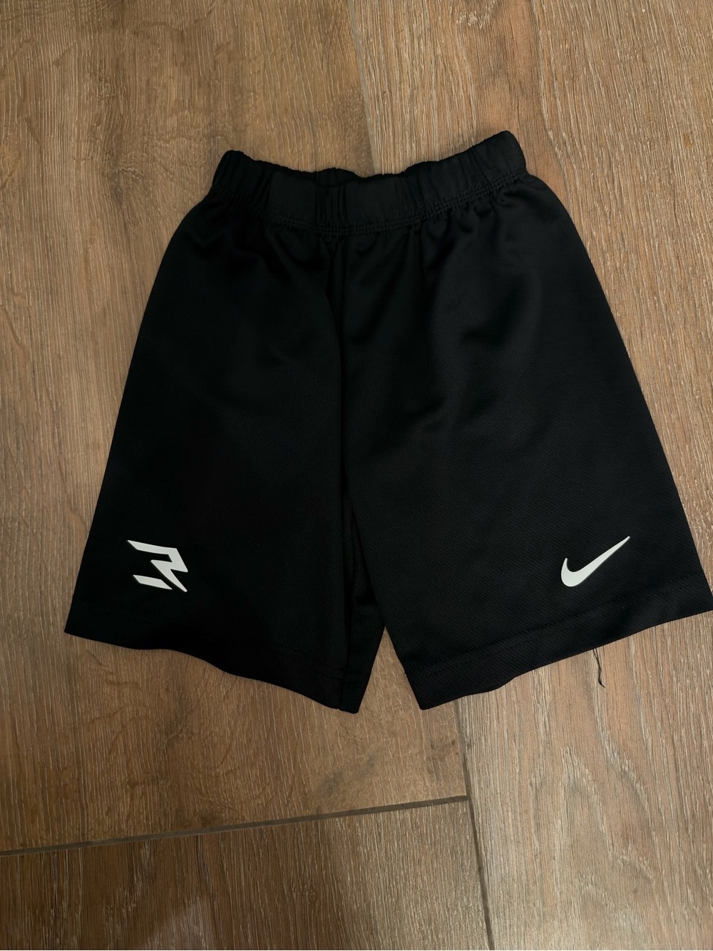 Nike Black Kids Athletic Shorts with White Swoosh and Logo